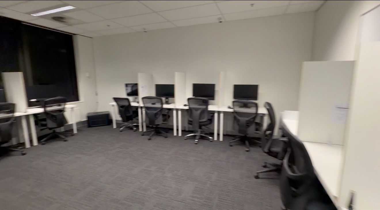 Modern computer-based testing room with workstations